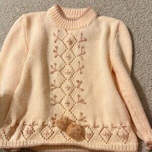 Elegant Cream Sweater with Pom Pom Detail